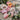 Bouquet of pink and white flowers on a textured surface