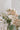 Small wedding table decor of three bud vases in soft blush, pink and cream tones from award winning wedding florist The Flower Lounge in Manchester.